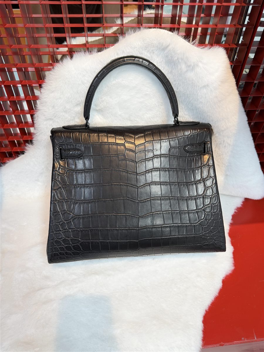 Black textured leather handbag